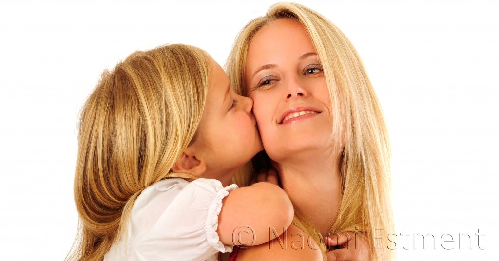 Daughter kissing Mom